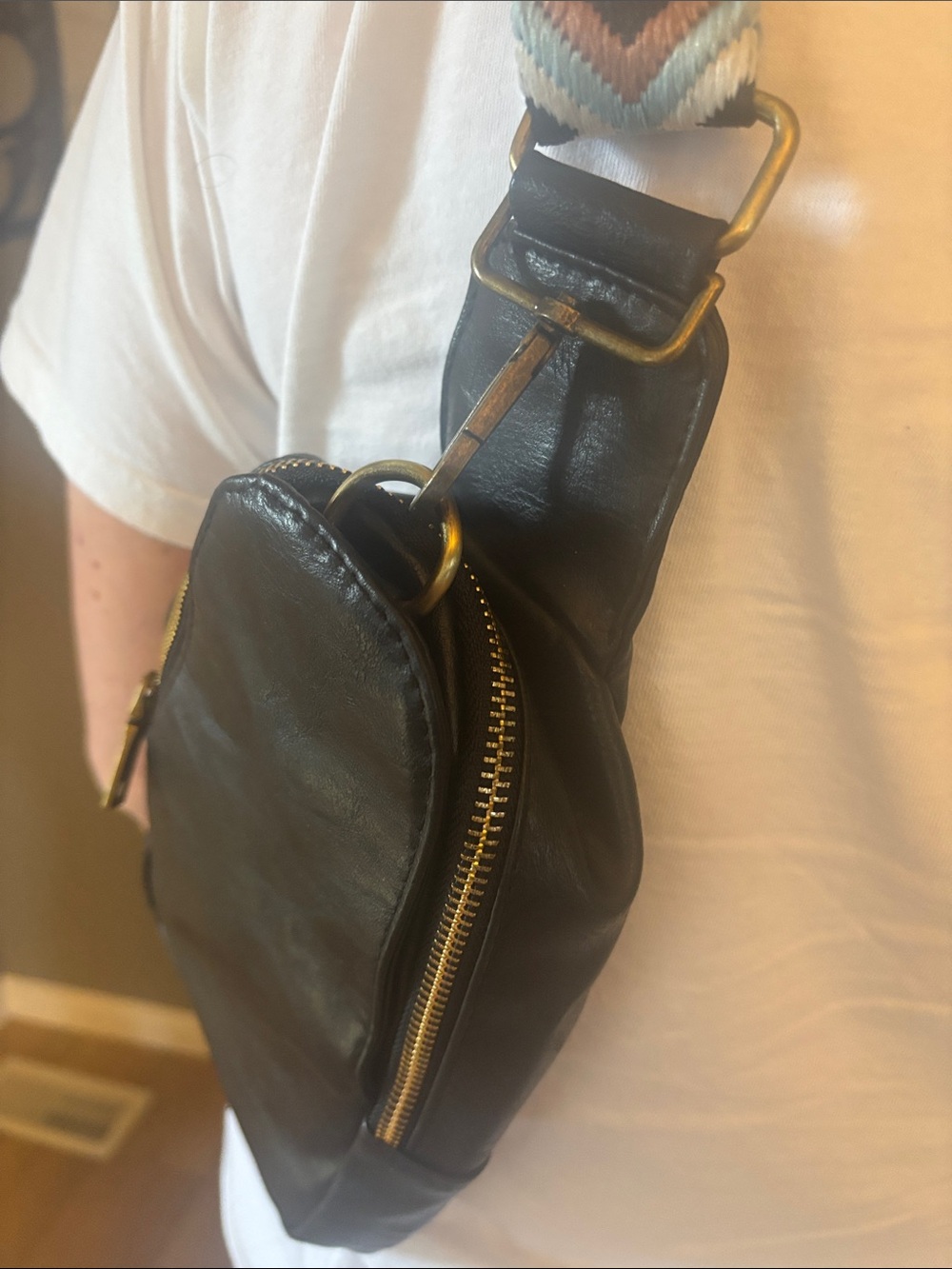 Black Leather Crossbody Bag with Brass Zipper and Adjustable Strap